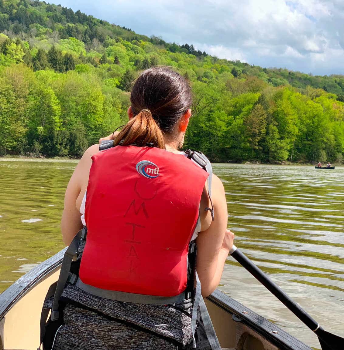 Woman on lake in canoe