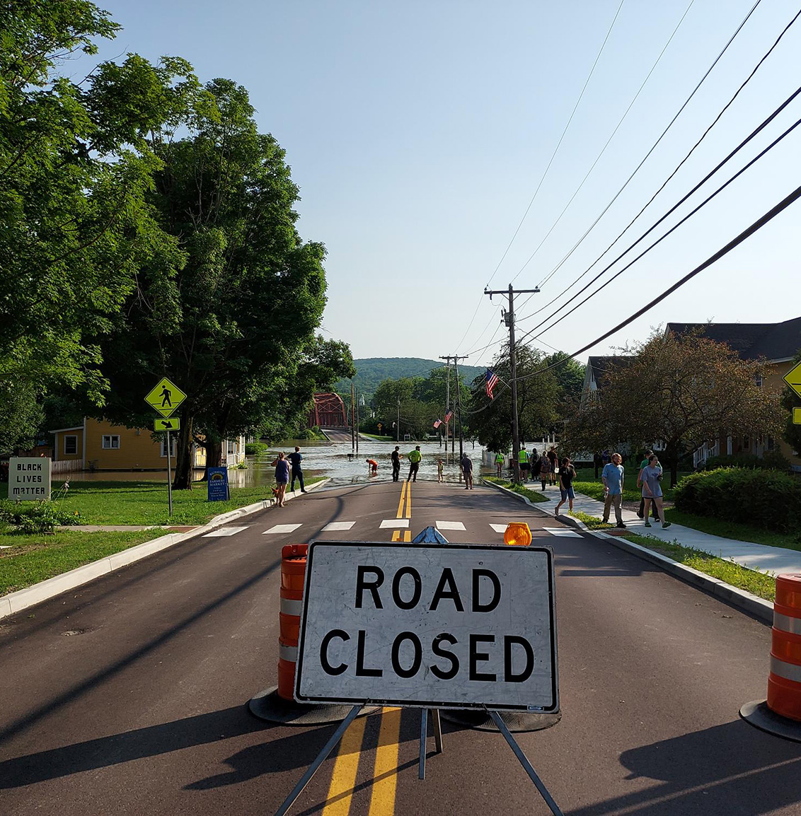 A road closed sign blocks a flooded road in Richmond Vermont.