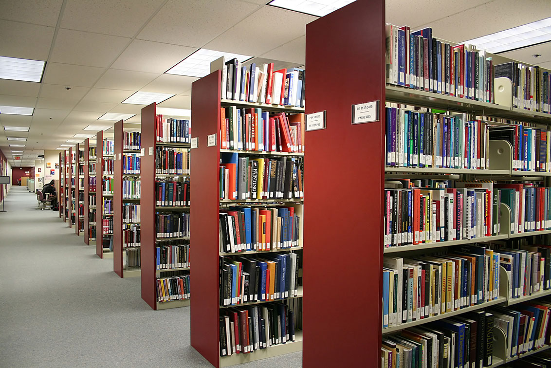rows of library shelving filled with books