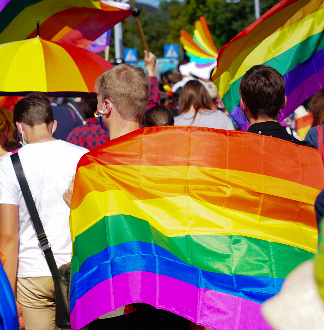 Teens marching in a pride parade.