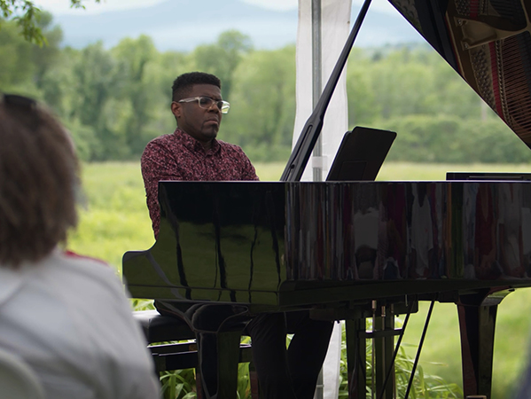 A concert pianist performs at Clemmons Family Farm in Charlotte Vermont.
