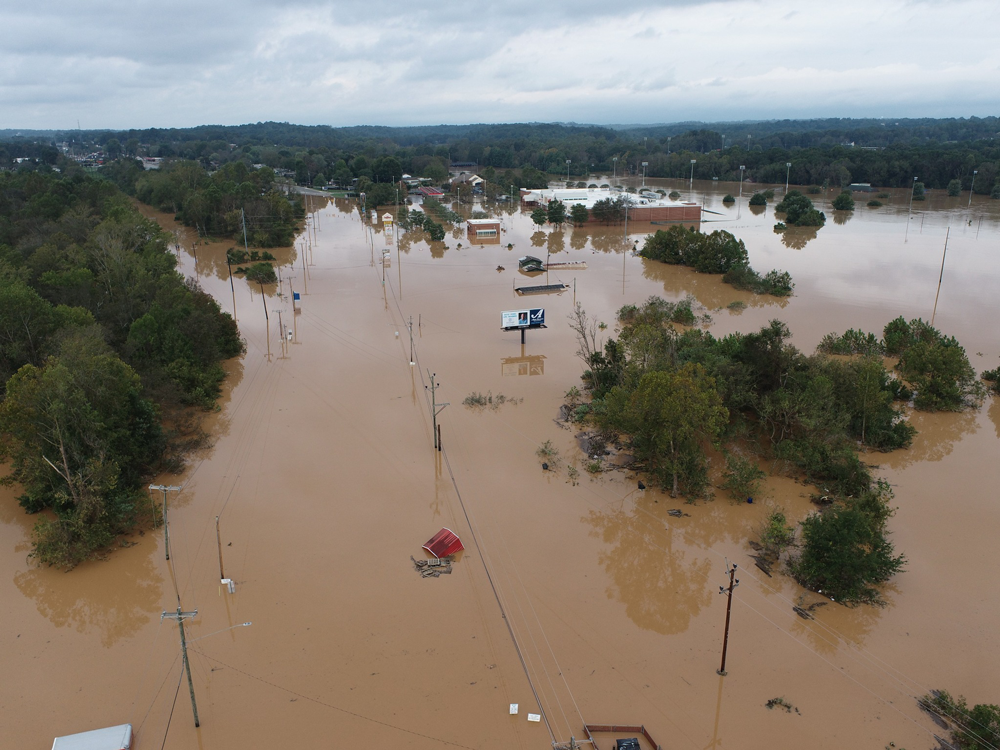 flooding over a large area of road and buildings