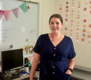 woman standing in her classroom