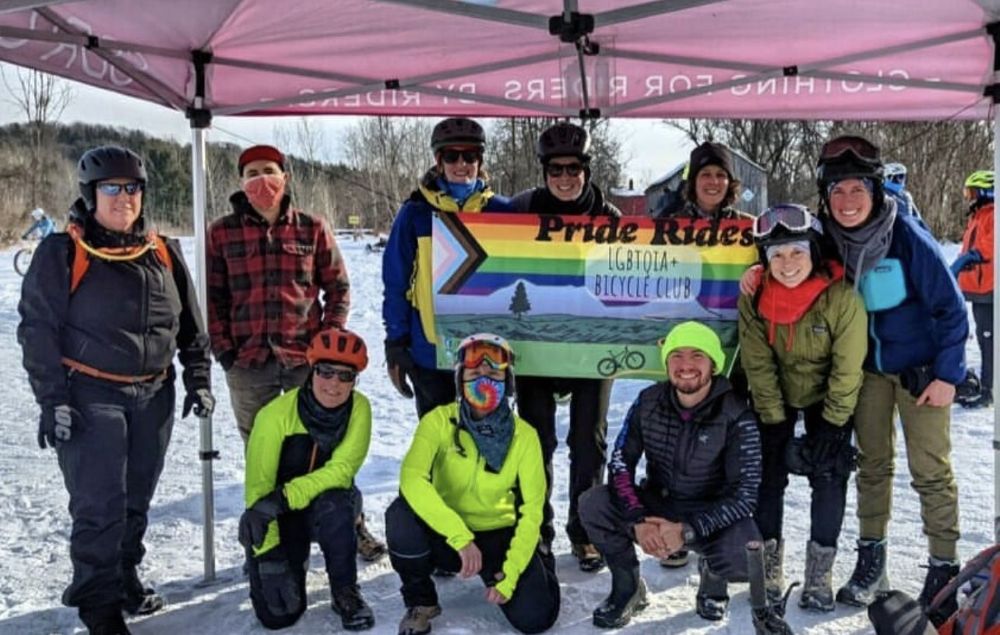 A group gathered outside at a Pride Rides event